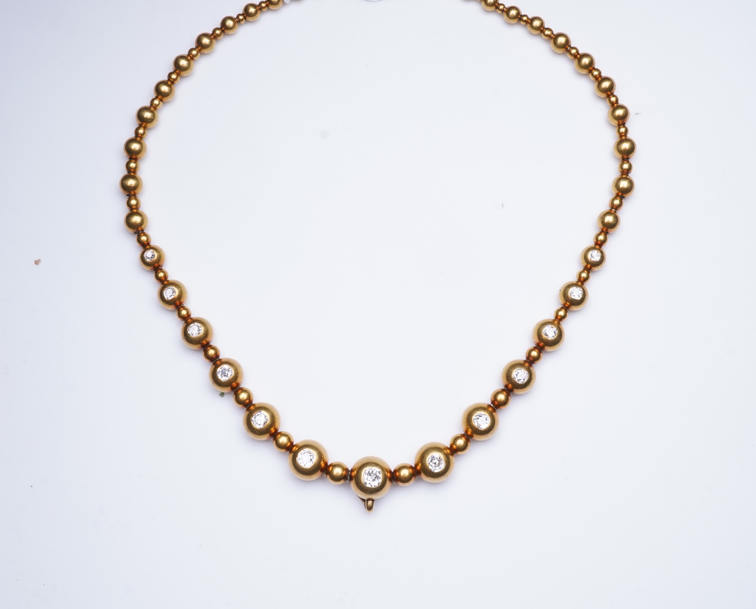 An unusual Victorian gold and diamond necklace, late 19th century